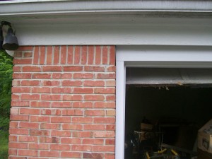 Garage door flush with brickwork after repair